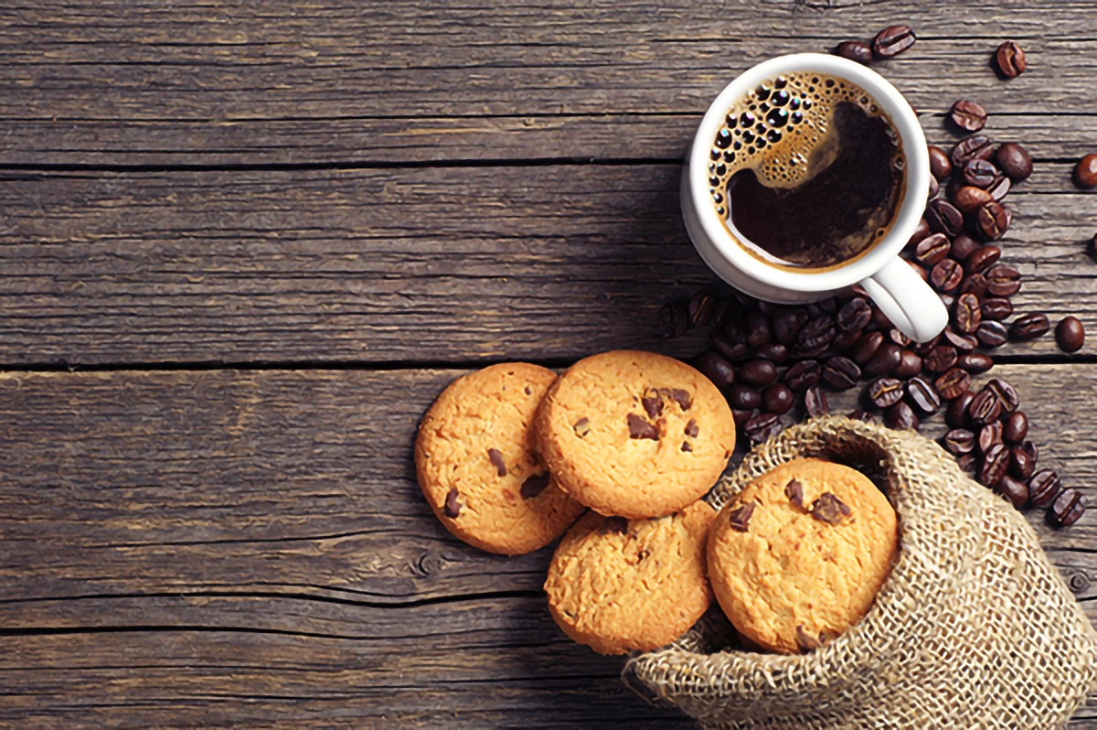 Image of tea and cookies on a wooden table